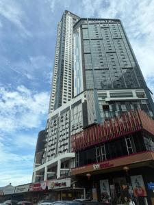 a large tall building with cars in front of it at Space Residency 2 bedroom 2 bathroom B59-11 in Johor Bahru