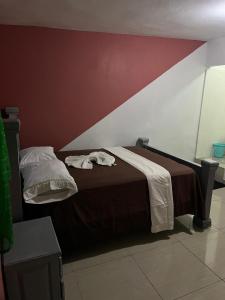 เตียงในห้องที่ BAYO-HOTEl +5 ภาพ
