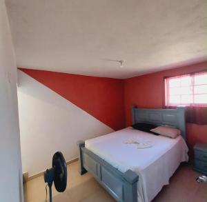 เตียงในห้องที่ BAYO-HOTEl