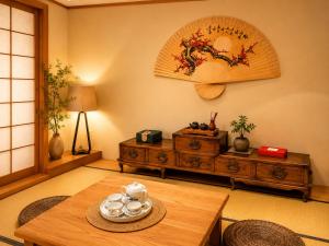 a living room with a table and a dresser at Van Nest near YVR UBC Downtown Free Parking in Vancouver