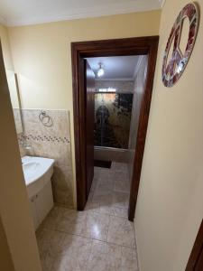 a bathroom with a sink and a mirror at Refugio serrano in Tandil +6 photos
