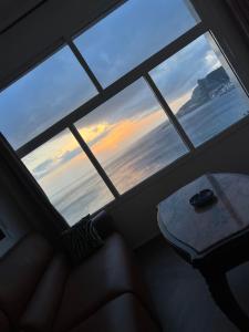 a view of a window with a table in front of it at La Vista Azul in Belyounech 