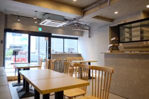 a dining room with tables and chairs in a restaurant at Luma Urban Hotel 高田馬場 in Tokyo +45 photos