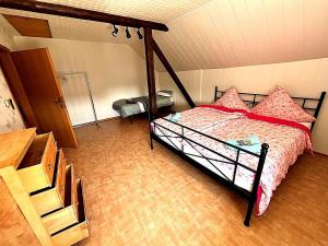 a bedroom with a bed with pink pillows at Holiday Home in Badem in Badem