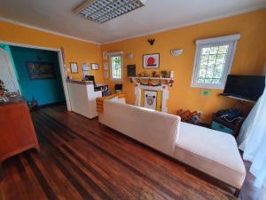 a living room with a couch and a fireplace at Jaguar Hostel in Viña del Mar