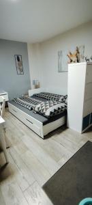 a bedroom with a large bed in a room at Ferienwohnung Bamberger mit Wintergarten Schmalkalden in Schmalkalden