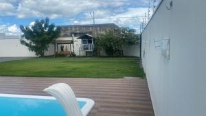 a view from the outside of a house with a swimming pool at Lar com piscina in Primavera do Leste