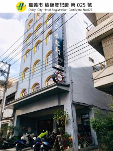 a building with a clock on the front of it at Prince Hotel in Chiayi City