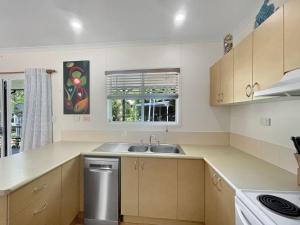 a kitchen with a sink and a window at Gigi's Getaway in Horseshoe Bay