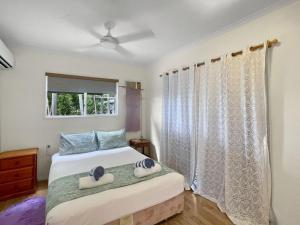 a bedroom with a bed with two towels on it at Gigi's Getaway in Horseshoe Bay +12 photos