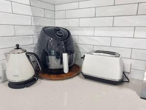 a blender and a toaster sitting on a counter at Runswick in Horseshoe Bay