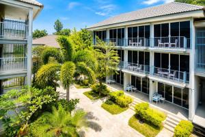 an aerial view of a building with a courtyard at Combo Beach Hotel Samui in Chaweng