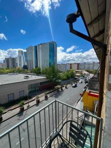 a view of a city street from a balcony at Russian Embassy Apartment in Ulaanbaatar