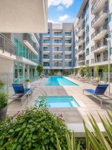 an image of a swimming pool in a building at Glendale Luxe Stays - Downtown in Glendale