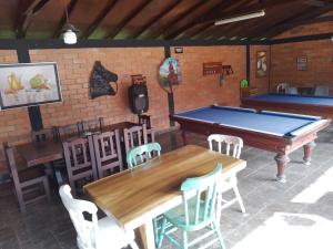 a room with a ping pong table and chairs at Villa Isabel in La Tebaida