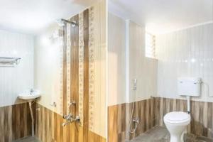 a bathroom with a shower and a toilet and a sink at PL Lodge in Pune