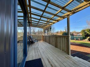 a porch with a pergola on a house at Modern Mountain Retreat in Ohakune