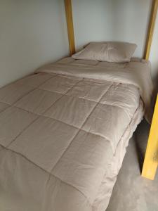 a bed with a wooden headboard in a bedroom at Casa Reyna in Hacienda Cienguilla +16 photos