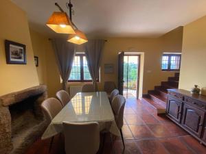 a dining room with a table and chairs at Detached 4 Bedroom Villa with Pool in Valencia de Alcántara