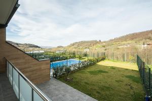 a view of a backyard with a swimming pool at CasaGurutze in Elizalde