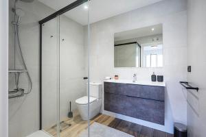 a bathroom with a toilet and a sink and a shower at CasaGurutze in Elizalde +8 photos