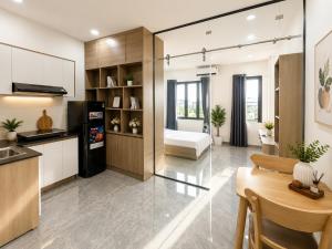 a kitchen and a living room with a dining room at Samaki Home in Ho Chi Minh City