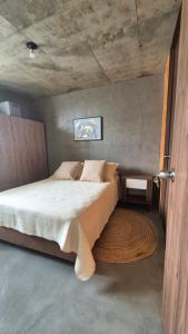 a bedroom with a large bed in a room at Loft type apartment premium style with pool in Barranquilla