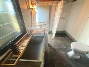 a bathroom with a toilet in a room at Our Place in South West Rocks +12 photos