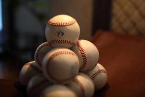 a pile of baseballs stacked on top of each other at tower eleven hotel in Kitahiroshima