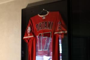 a redttenham shirt hanging on a wall at tower eleven hotel in Kitahiroshima