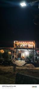 a train on top of a building at night at A thám homesstay in Dam Thuy