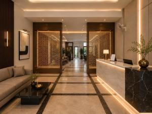 a living room with a couch and a lobby at Sapphire Hotel & Convention Centre in Baddi