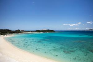 an aerial view of a beach in the ocean at Courtyard by Marriott Okinawa Resort in Nago