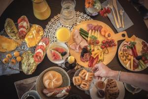 a table with many plates of food on it at das Ebner in Stubenberg +12 photos