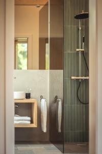 a bathroom with a shower and a sink at das Ebner in Stubenberg