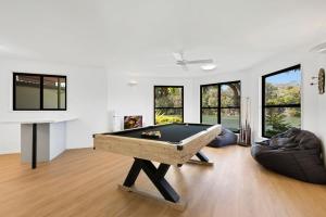 a living room with a pool table in it at Wyuna Drive 53 in Noosaville