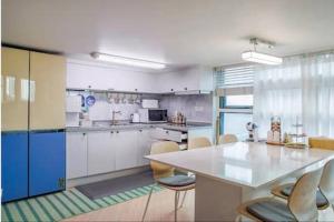 a kitchen with a table and chairs in a room at Young Stay in Seoul