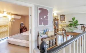 a living room with a bed and a staircase at Young Stay in Seoul