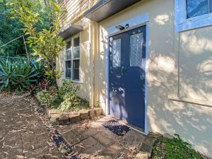a blue door of a house with a window at The Captains Manor on Cook 8 in Arcadia