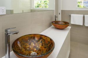 a bathroom with a sink and a bowl on a counter at Reflections Amber Villa 2 in Picnic Bay