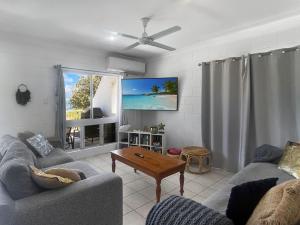 a living room with two couches and a tv at Arcadia Beach Unit 4 in Arcadia