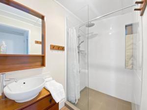 a bathroom with a sink and a shower at The Barracks Arcadia 2 in Arcadia +5 photos