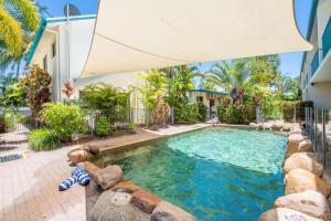 a swimming pool with a teddy bear in front of a house at Sails on Horseshoe Apartment 4 in Horseshoe Bay