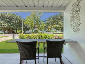 a table and two chairs sitting on a patio at Island View Apt 1 in Arcadia