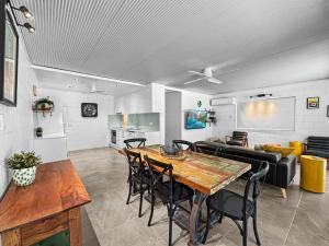 a dining room and living room with a table and chairs at Island View Apt 1 in Arcadia