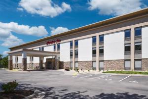 an office building with a parking lot at Hampton Inn Janesville in Janesville
