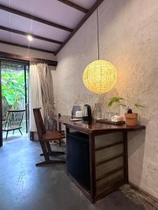 a room with a desk with a lamp and a chair at CasaWa Homestay Hue in Thôn Trường Giang +48 photos