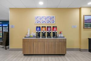 a counter with alcohol bottles on top of it at Hampton Inn Richmond KY in Richmond