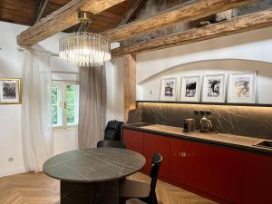 a kitchen with a table and a dining room at Monte-Rosa in Karlovy Vary
