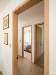 a hallway with a door leading to a bedroom at Guantalamera Resort in Tubará +12 photos